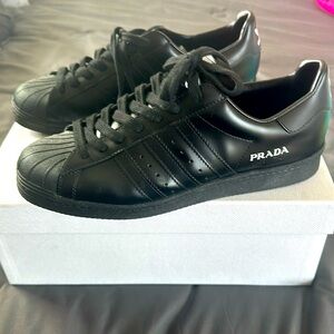 Prada made in Italy shell toe Adidas color black in men’s.100% Authentic.